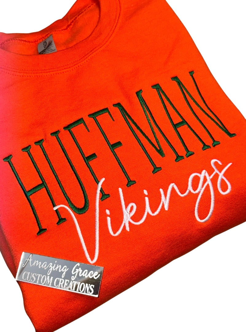 orange sweartshirt with 'Huffman Vikings' text and 'Amazing Grace Custom Creations' label.